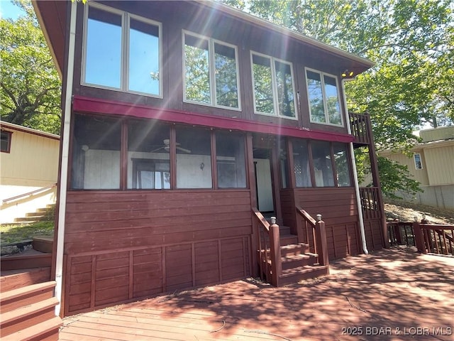 192 Ke Jo Point Rd, Gravois Mills, MO 65037 - rustic home featuring a sunroom and a deck