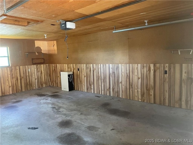 192 Ke Jo Point Rd, Gravois Mills, MO 65037 - garage featuring a garage door opener and wooden walls