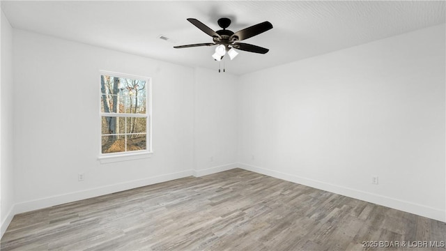 3164 Cross Creek Dr, Camdenton, MO 65020 - unfurnished room with wood finished floors and ceiling fan