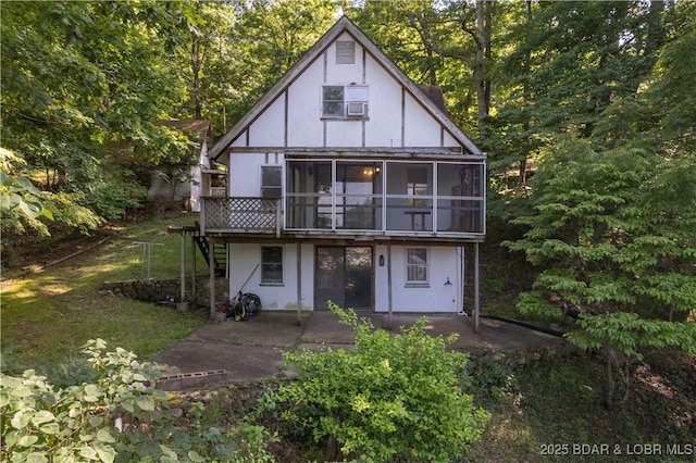 15617 Santa Fe Trl, Gravois Mills, MO 65037 - back of house with a sunroom, a patio, stairway, stucco siding, and a deck
