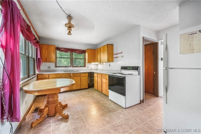 15617 Santa Fe Trl, Gravois Mills, MO 65037 - kitchen featuring white appliances, light countertops, a textured ceiling, and brown cabinets