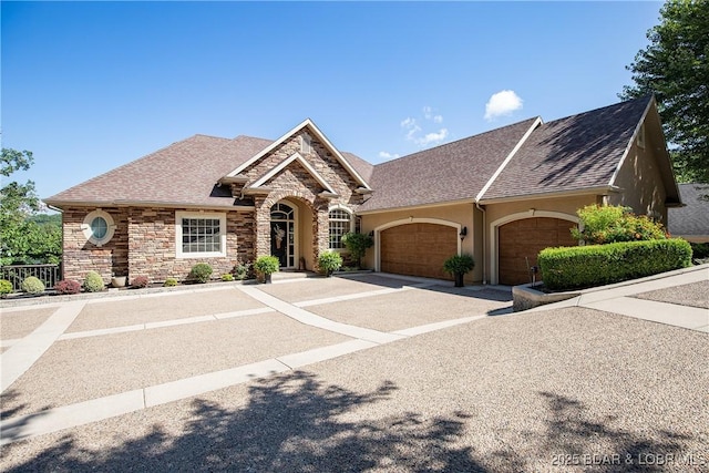 1163 Beacon Pointe Cir, Lake Ozark, MO 65049 - view of front of house with a garage, stone siding, concrete driveway, stucco siding, and a shingled roof