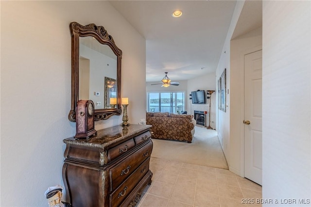 492 Regatta Bay Dr Unit 2D, Lake Ozark, MO 65049 - hallway featuring light carpet, light tile patterned floors, and recessed lighting