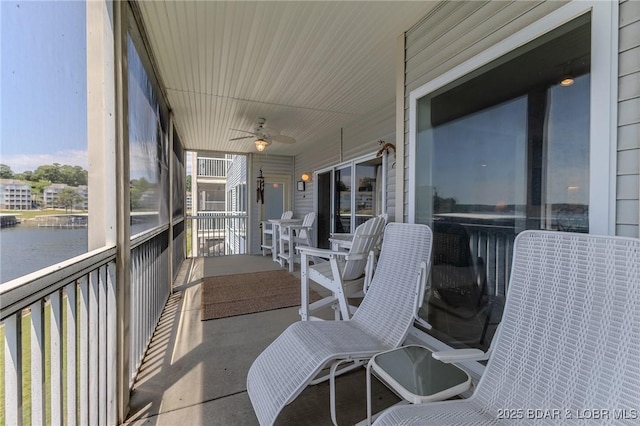 492 Regatta Bay Dr Unit 2D, Lake Ozark, MO 65049 - sunroom / solarium with ceiling fan, healthy amount of natural light, and a water view