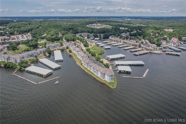 492 Regatta Bay Dr Unit 2D, Lake Ozark, MO 65049 - drone / aerial view of a nearby body of water and a heavily wooded area