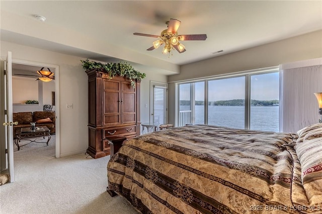 492 Regatta Bay Dr Unit 2D, Lake Ozark, MO 65049 - bedroom featuring light colored carpet, a water view, ceiling fan, and access to outside
