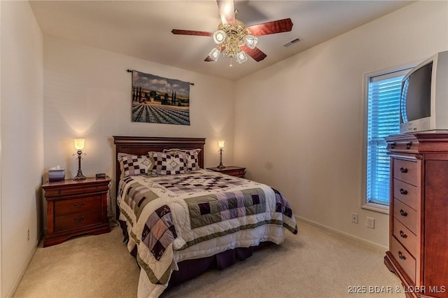 492 Regatta Bay Dr Unit 2D, Lake Ozark, MO 65049 - bedroom with light carpet, multiple windows, and a ceiling fan