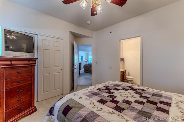 492 Regatta Bay Dr Unit 2D, Lake Ozark, MO 65049 - bedroom with light colored carpet, ensuite bath, and ceiling fan