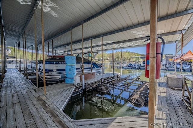 6570 Pelican Dr Unit 404, Osage Beach, MO 65065 - dock area with boat lift and a water view