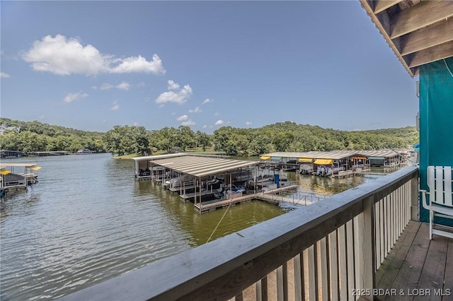 6570 Pelican Dr Unit 404, Osage Beach, MO 65065 - dock with a water view and a wooded view