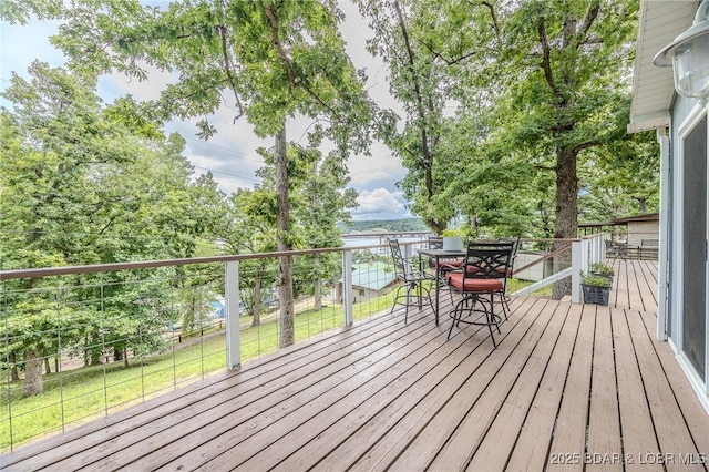 54 White Rock Ln, Sunrise Beach, MO 65079 - wooden terrace featuring outdoor dining area