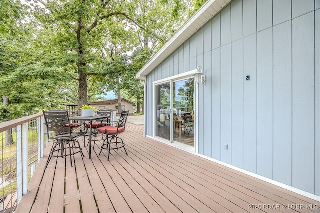 54 White Rock Ln, Sunrise Beach, MO 65079 - wooden terrace with outdoor dining area