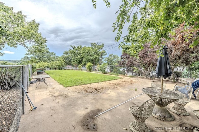 54 White Rock Ln, Sunrise Beach, MO 65079 - fenced backyard with a patio area