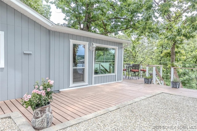 54 White Rock Ln, Sunrise Beach, MO 65079 - wooden deck with outdoor dining space