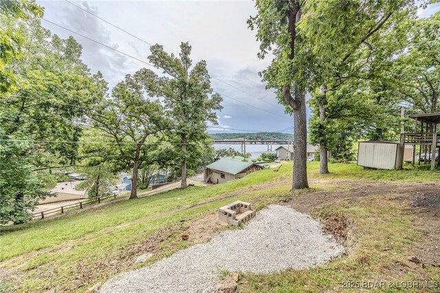 54 White Rock Ln, Sunrise Beach, MO 65079 - view of yard with a storage shed