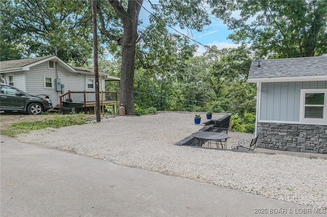54 White Rock Ln, Sunrise Beach, MO 65079 - view of yard featuring a wooden deck