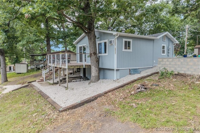 54 White Rock Ln, Sunrise Beach, MO 65079 - back of house with a deck and stairway