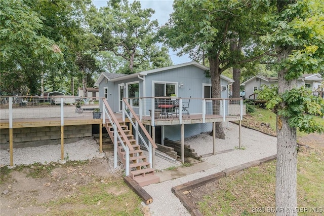54 White Rock Ln, Sunrise Beach, MO 65079 - back of house with a deck and stairs