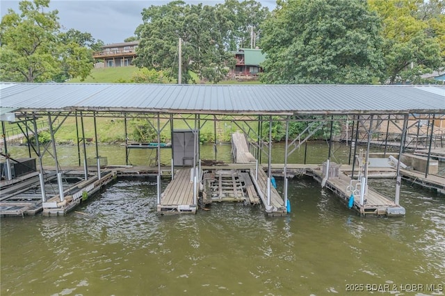 54 White Rock Ln, Sunrise Beach, MO 65079 - dock area featuring boat lift and a water view