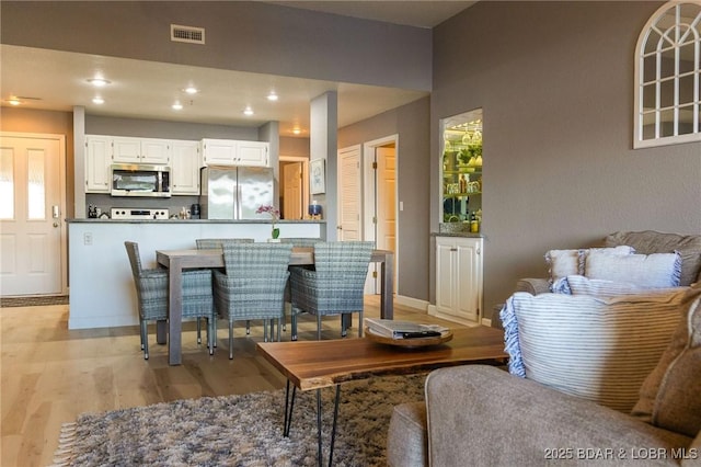 46 Aqua Fin Dr Unit 4A, Lake Ozark, MO 65049 - living room with light wood-style floors and recessed lighting