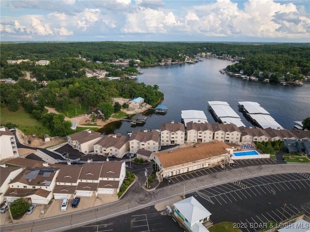 46 Aqua Fin Dr Unit 4A, Lake Ozark, MO 65049 - drone / aerial view of a nearby body of water and a heavily wooded area