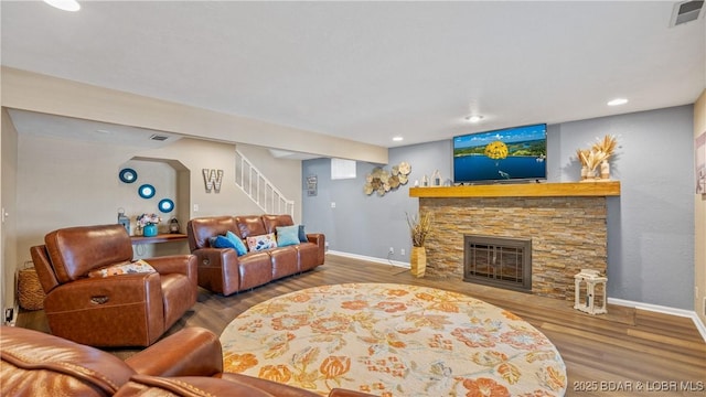 161 Tanglewood Dr, Camdenton, MO 65020 - living room featuring stairs, a fireplace, wood finished floors, and recessed lighting