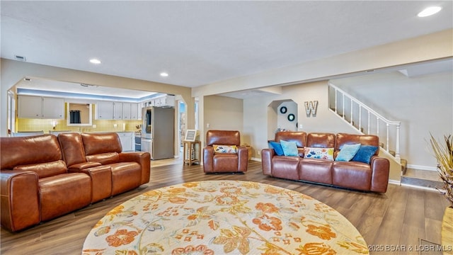 161 Tanglewood Dr, Camdenton, MO 65020 - living area with wood finished floors, recessed lighting, and stairway