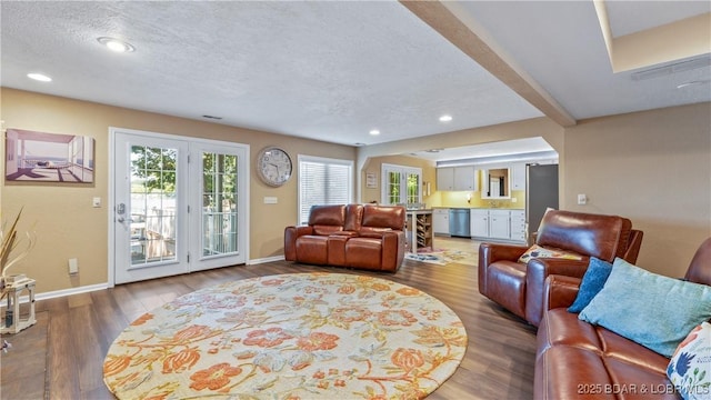 161 Tanglewood Dr, Camdenton, MO 65020 - living room with wood finished floors, a textured ceiling, and recessed lighting