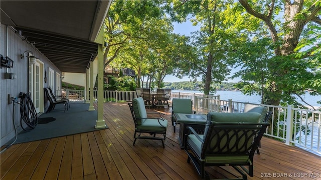 161 Tanglewood Dr, Camdenton, MO 65020 - deck featuring a water view and outdoor dining area
