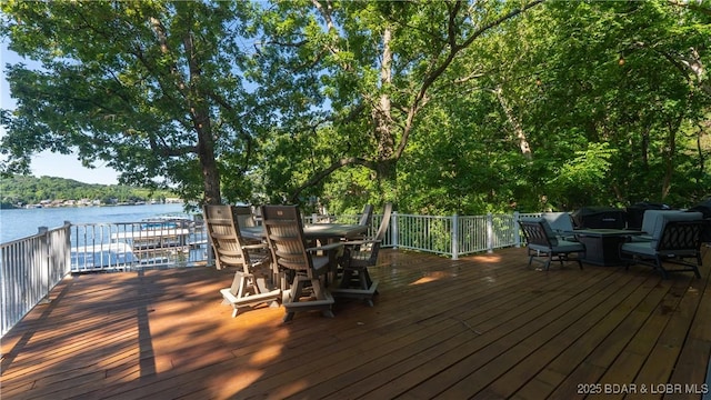 161 Tanglewood Dr, Camdenton, MO 65020 - deck with outdoor dining area and a water view
