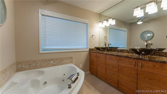 161 Tanglewood Dr, Camdenton, MO 65020 - full bath with double vanity, a tub with jets, ceiling fan, and tile patterned flooring