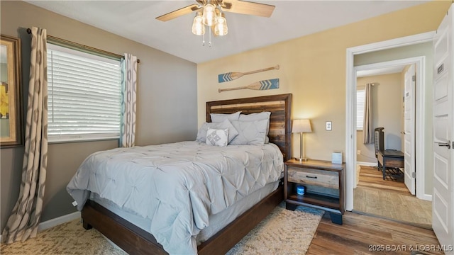 161 Tanglewood Dr, Camdenton, MO 65020 - bedroom with wood finished floors and ceiling fan