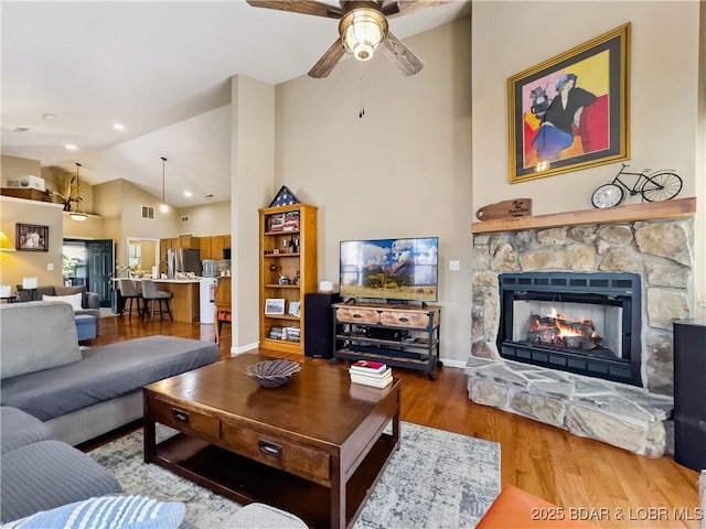 110 Golf View Dr, Camdenton, MO 65020 - living area featuring a ceiling fan, wood finished floors, a fireplace, high vaulted ceiling, and recessed lighting