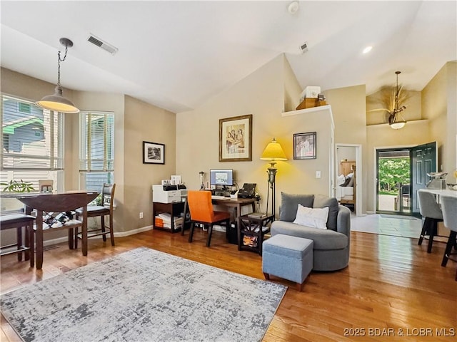 110 Golf View Dr, Camdenton, MO 65020 - living room with plenty of natural light, wood finished floors, an office area, and high vaulted ceiling