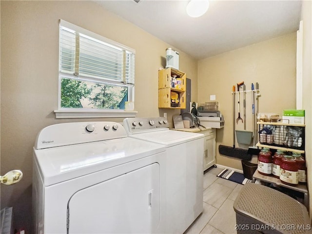 110 Golf View Dr, Camdenton, MO 65020 - laundry area with cabinet space, washer and clothes dryer, and light tile patterned floors