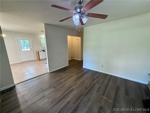 868 E St, Lebanon, MO 65536 - unfurnished room with a ceiling fan and dark wood-style floors