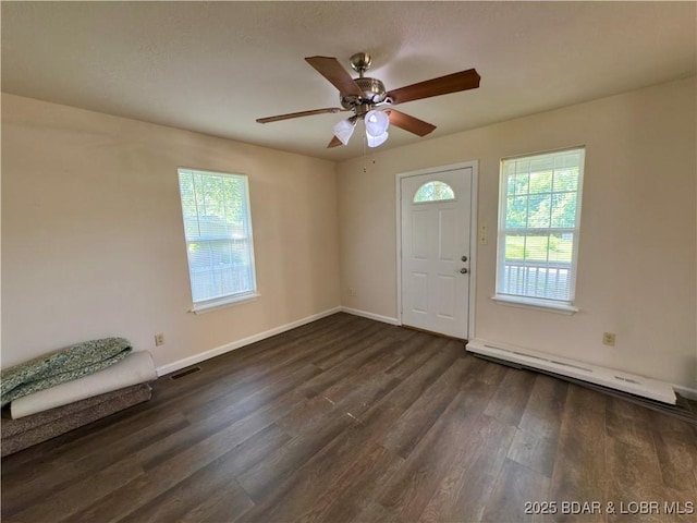 868 E St, Lebanon, MO 65536 - entryway with a baseboard heating unit, healthy amount of natural light, dark wood-type flooring, and a ceiling fan