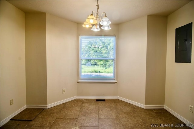 868 E St, Lebanon, MO 65536 - unfurnished dining area featuring electric panel, a chandelier, and tile patterned floors