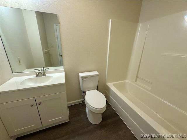 868 E St, Lebanon, MO 65536 - bathroom with wood finished floors, vanity, and  shower combination