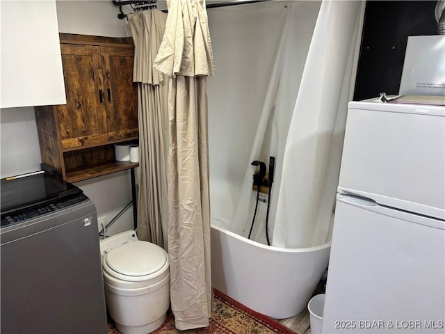31475 Ivy Bend Rd, Stover, MO 65078 - bathroom with washer / clothes dryer and toilet