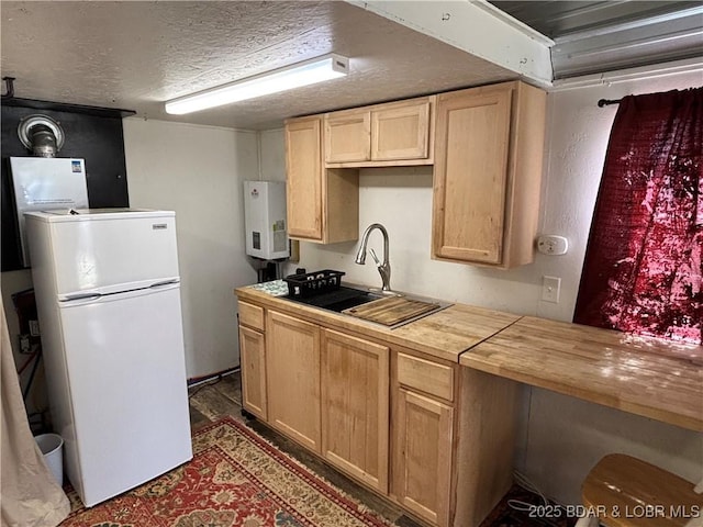 31475 Ivy Bend Rd, Stover, MO 65078 - kitchen featuring fridge, water heater, butcher block counters, and light brown cabinets