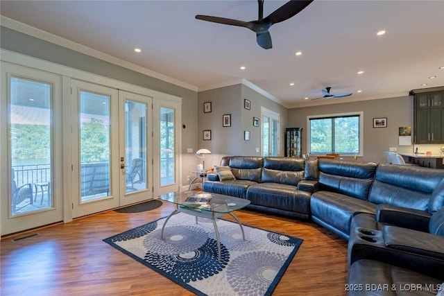 87 Glenmeadows Ct, Linn Creek, MO 65052 - living area with a ceiling fan, french doors, wood finished floors, recessed lighting, and crown molding