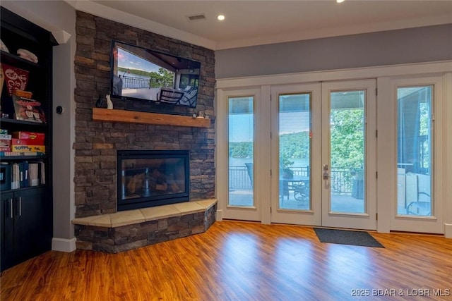 87 Glenmeadows Ct, Linn Creek, MO 65052 - doorway featuring wood finished floors and a fireplace