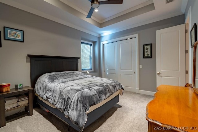 87 Glenmeadows Ct, Linn Creek, MO 65052 - bedroom featuring crown molding, a closet, light colored carpet, a tray ceiling, and ceiling fan