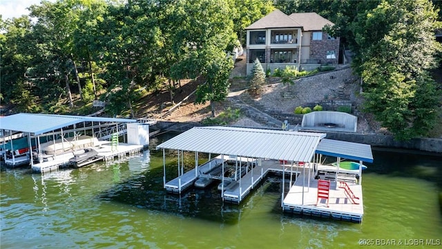 87 Glenmeadows Ct, Linn Creek, MO 65052 - dock area featuring boat lift and a water view