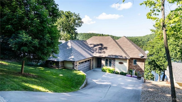 87 Glenmeadows Ct, Linn Creek, MO 65052 - view of front of house featuring an attached garage, driveway, stone siding, and a front lawn