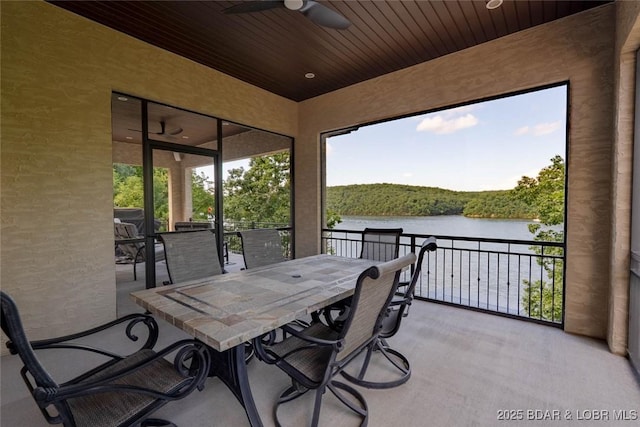87 Glenmeadows Ct, Linn Creek, MO 65052 - view of patio featuring ceiling fan, a water view, and outdoor dining area