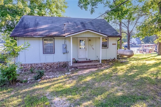 4230 Fox Hollow Ln, Stover, MO 65078 - view of front of home featuring a front yard and a shingled roof
