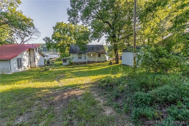 4230 Fox Hollow Ln, Stover, MO 65078 - view of grassy yard featuring a storage shed