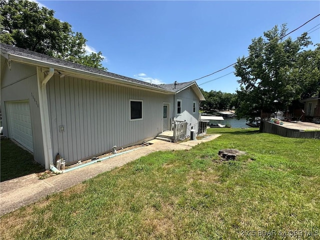 30024 Hawaii Rd, Gravois Mills, MO 65037 - view of green lawn with a garage